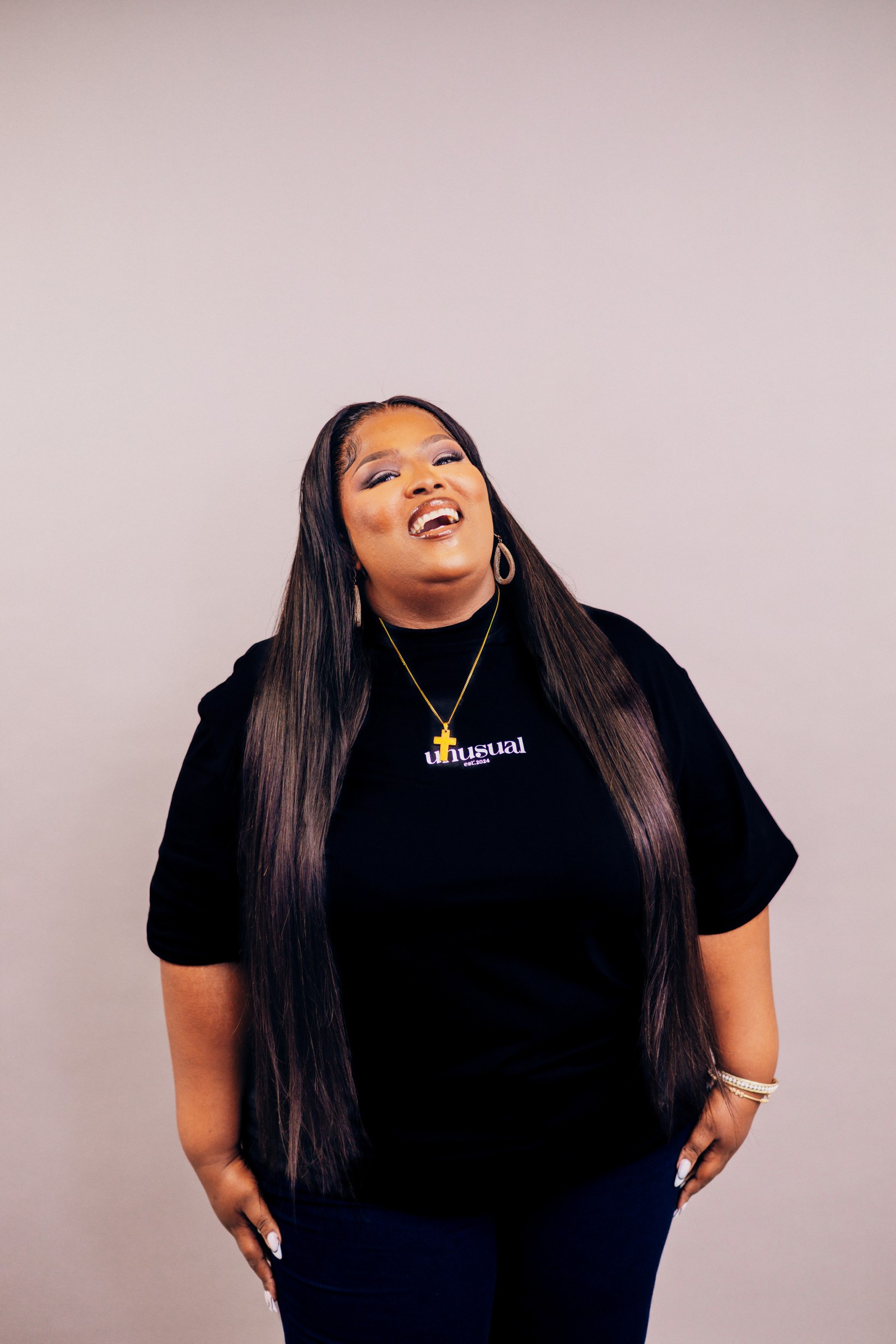 A model wearing a black Unusual T-shirt