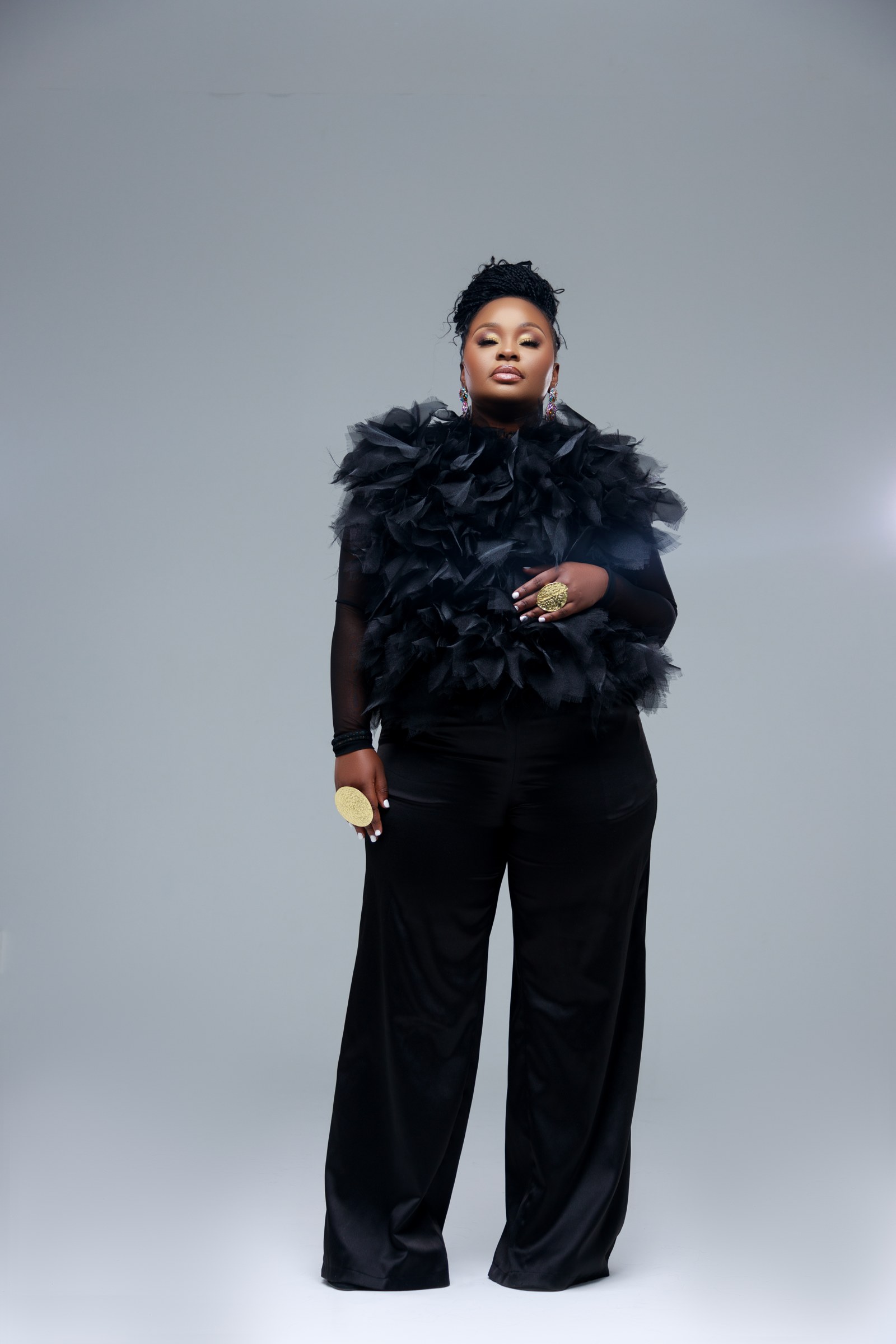 Full-length black studio portrait