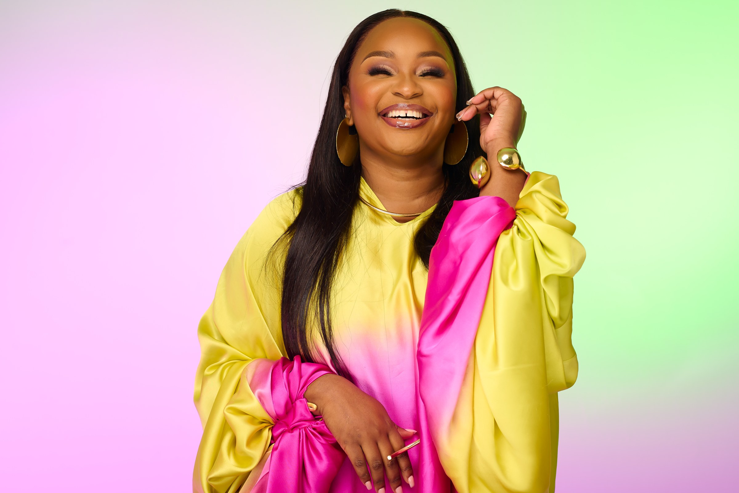 Xolly smiling in yellow and pink